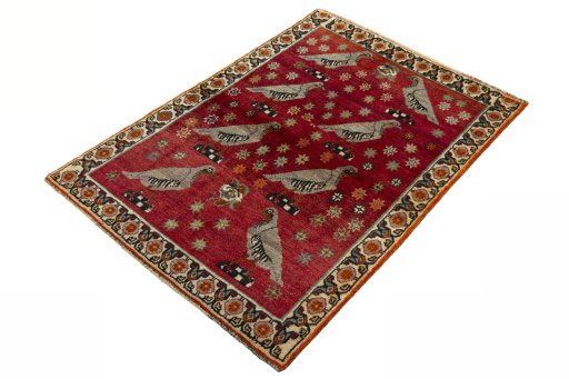 Corner detail of 2000s Persian Gabbeh rug showing border pattern and Wool pile