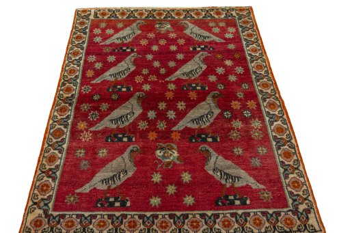 Surface texture of 2000s Persian Gabbeh rug with natural Wool and intricate pattern