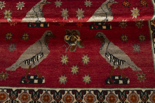 Full view of 2000s Persian Gabbeh rug from Iran / Persia, 165 × 115 cm in Red tones