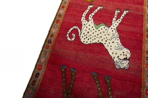 Backside of handmade 2000s Persian Gabbeh rug showing knot structure and weave density