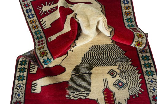 Corner detail of 2000s Persian Gabbeh rug showing border pattern and Wool pile
