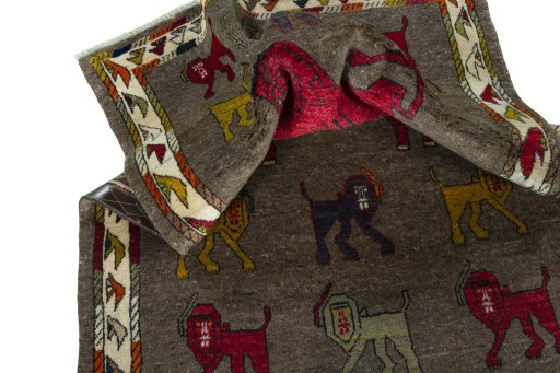Corner detail of 2000s Persian Gabbeh rug showing border pattern and Wool pile