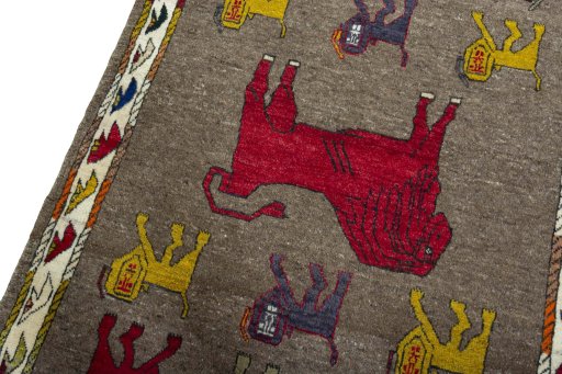 Backside of handmade 2000s Persian Gabbeh rug showing knot structure and weave density