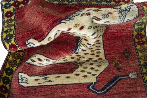 Corner detail of 2000s Persian Gabbeh rug showing border pattern and Wool pile