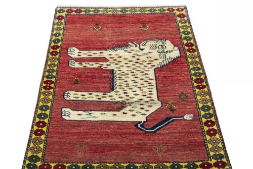Surface texture of 2000s Persian Gabbeh rug with natural Wool and intricate pattern