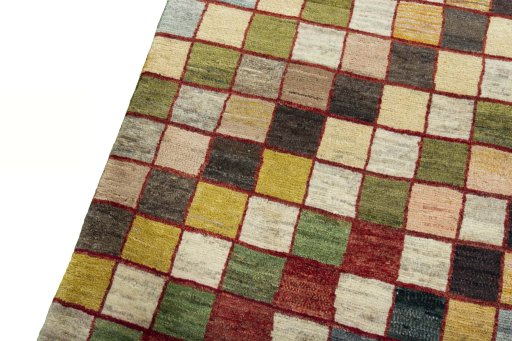 Backside of handmade 2000s Persian Gabbeh rug showing knot structure and weave density