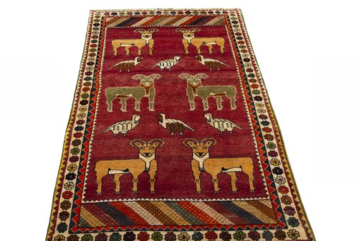Surface texture of 2000s Persian Gabbeh rug with natural Wool and intricate pattern