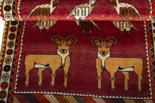 Full view of 2000s Persian Gabbeh rug from Iran / Persia, 189 × 107 cm in Red tones