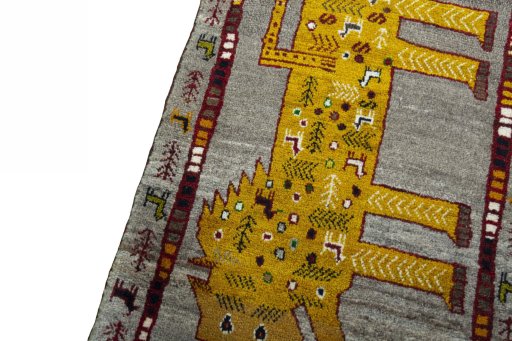 Backside of handmade New Persian Gabbeh rug showing knot structure and weave density