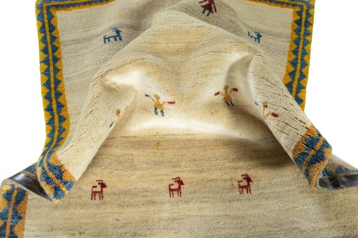 Corner detail of 2000s Persian Gabbeh rug showing border pattern and Wool pile