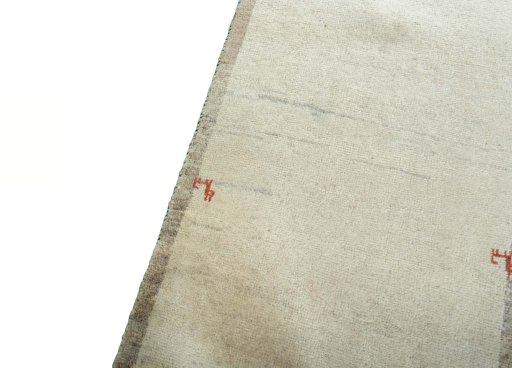 Backside of handmade New Persian Gabbeh rug showing knot structure and weave density
