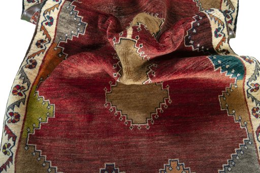 Corner detail of 2000s Persian Gabbeh rug showing border pattern and Wool pile