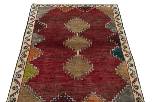 Surface texture of 2000s Persian Gabbeh rug with natural Wool and intricate pattern