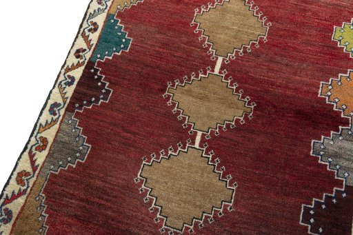 Backside of handmade 2000s Persian Gabbeh rug showing knot structure and weave density
