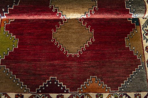 Full view of 2000s Persian Gabbeh rug from Iran / Persia, 143 × 108 cm in Red tones