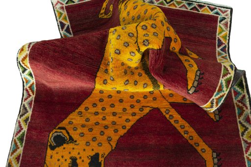 Corner detail of 2000s Persian Gabbeh rug showing border pattern and Wool pile