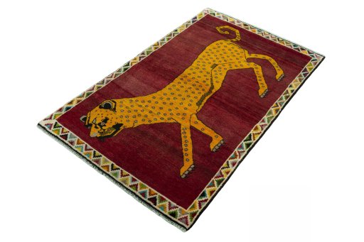 Corner detail of 2000s Persian Gabbeh rug showing border pattern and Wool pile