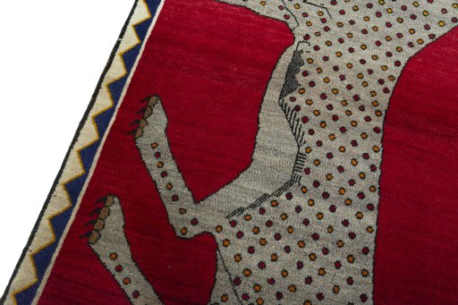 Backside of handmade 2000s Persian Gabbeh rug showing knot structure and weave density