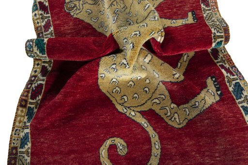 Corner detail of 2000s Persian Gabbeh rug showing border pattern and Wool pile