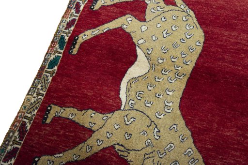 Backside of handmade 2000s Persian Gabbeh rug showing knot structure and weave density