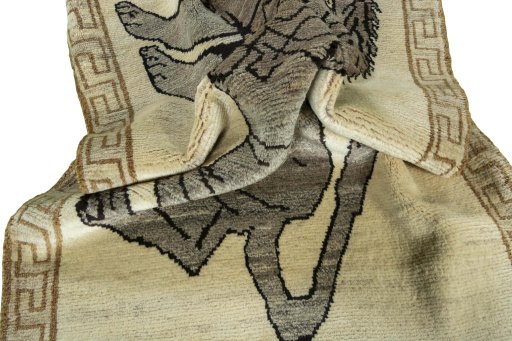 Corner detail of 2000s Persian Gabbeh rug showing border pattern and Wool pile