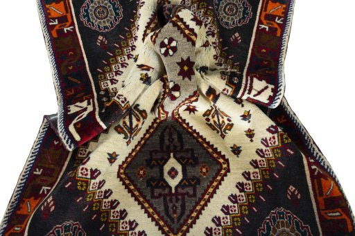 Corner detail of 2000s Persian Gabbeh rug showing border pattern and Wool pile