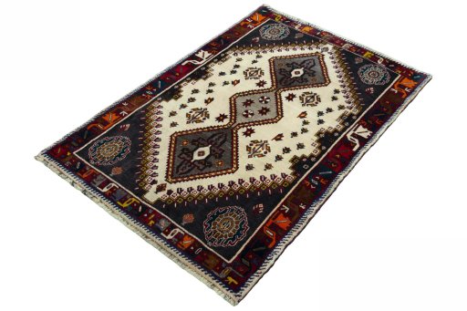 Corner detail of 2000s Persian Gabbeh rug showing border pattern and Wool pile