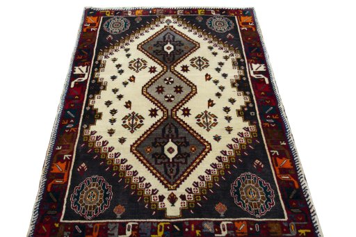 Surface texture of 2000s Persian Gabbeh rug with natural Wool and intricate pattern
