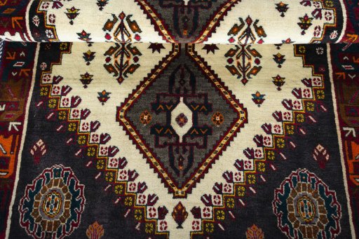 Full view of 2000s Persian Gabbeh rug from Iran / Persia, 164 × 110 cm in Beige tones