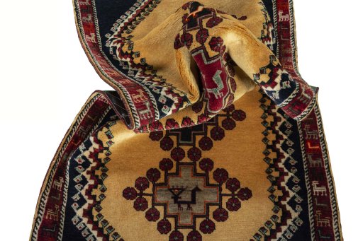 Corner detail of 2000s Persian Gabbeh rug showing border pattern and Wool pile