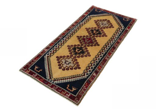 Corner detail of 2000s Persian Gabbeh rug showing border pattern and Wool pile