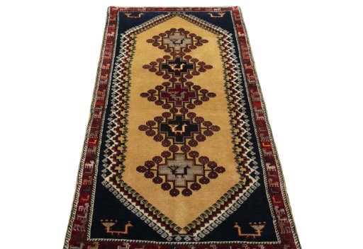 Surface texture of 2000s Persian Gabbeh rug with natural Wool and intricate pattern