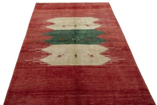 Surface texture of 2000s Persian Gabbeh rug with natural Wool and intricate pattern