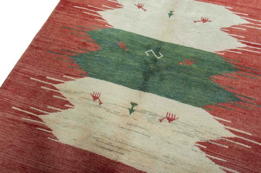 Backside of handmade 2000s Persian Gabbeh rug showing knot structure and weave density