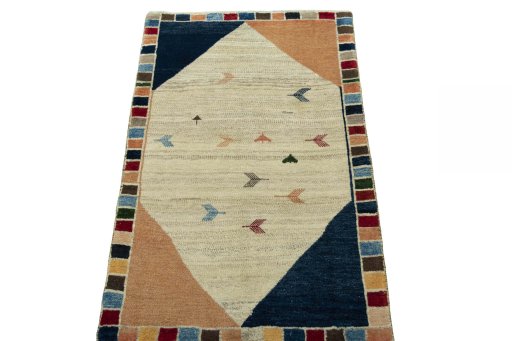 Surface texture of 2000s Persian Gabbeh rug with natural Wool and intricate pattern