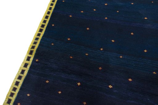 Backside of handmade 2000s Persian Gabbeh rug showing knot structure and weave density