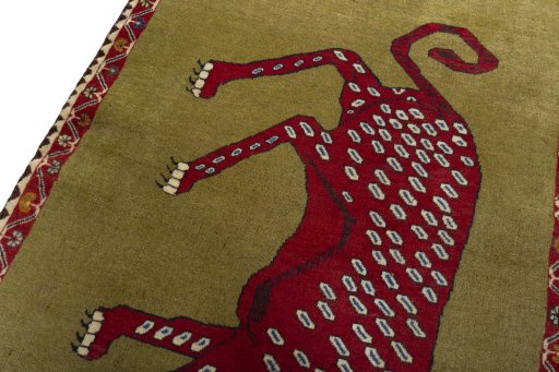 Backside of handmade 2000s Persian Gabbeh rug showing knot structure and weave density