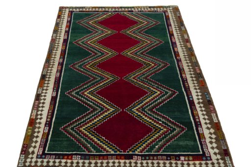 Surface texture of 2000s Persian Gabbeh rug with natural Wool and intricate pattern