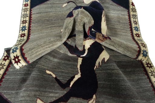 Corner detail of 2000s Persian Gabbeh rug showing border pattern and Wool pile