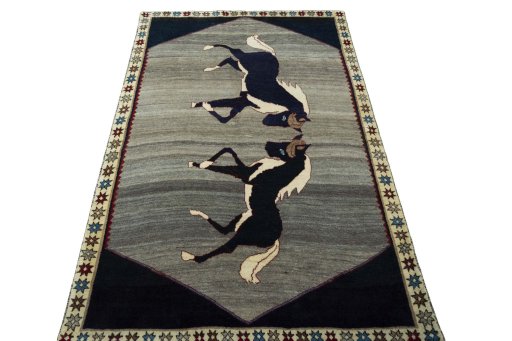 Surface texture of 2000s Persian Gabbeh rug with natural Wool and intricate pattern