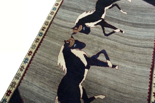 Backside of handmade 2000s Persian Gabbeh rug showing knot structure and weave density