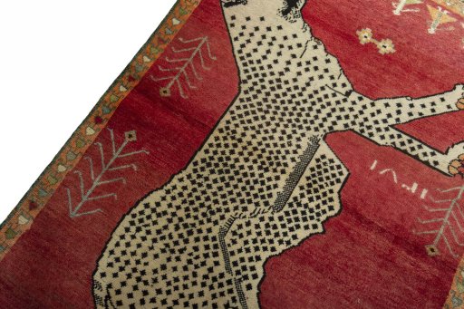 Backside of handmade 2000s Persian Gabbeh rug showing knot structure and weave density
