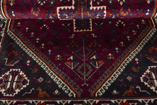 Corner detail of 2000s Persian Gabbeh rug showing border pattern and Wool pile