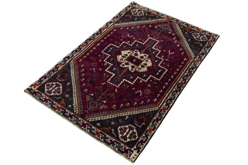 Corner detail of 2000s Persian Gabbeh rug showing border pattern and Wool pile