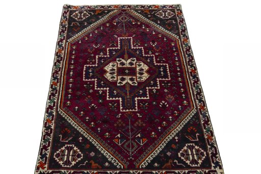 Surface texture of 2000s Persian Gabbeh rug with natural Wool and intricate pattern