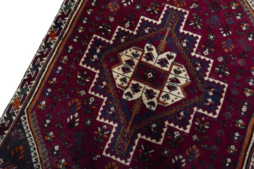 Backside of handmade 2000s Persian Gabbeh rug showing knot structure and weave density
