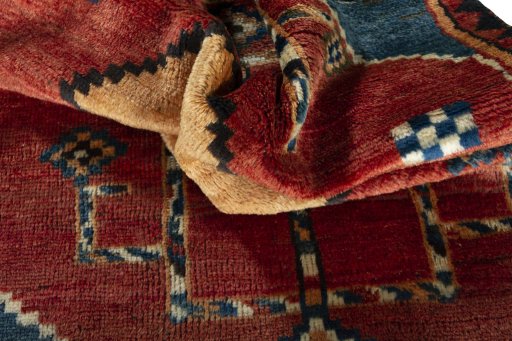 Corner detail of 1950s Persian Gabbeh rug showing border pattern and Wool pile