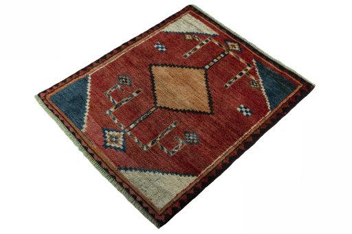 Corner detail of 1950s Persian Gabbeh rug showing border pattern and Wool pile