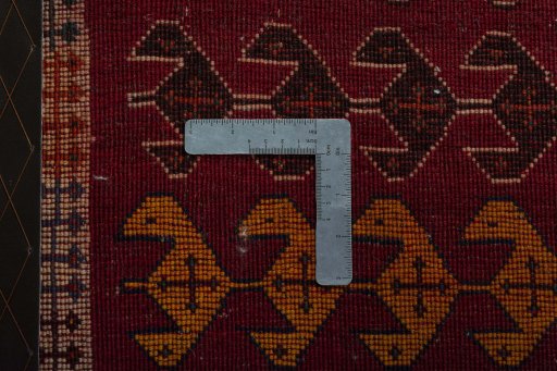 Corner detail of 2000s Persian Gabbeh rug showing border pattern and Wool pile