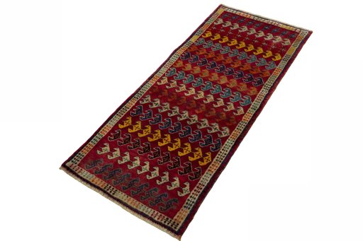 Corner detail of 2000s Persian Gabbeh rug showing border pattern and Wool pile
